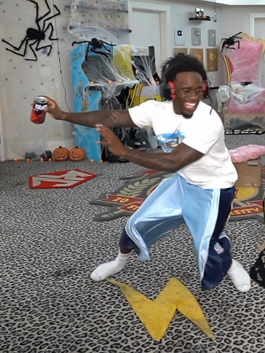Kai Cenat dancing in the Obsidian Blue Worldwide Polyester Jorts
