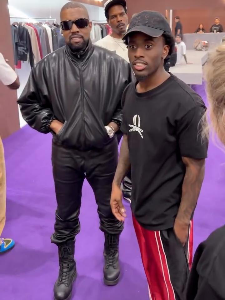 Kai Cenat beside Ye in the Black Red Worldwide Polyester Jorts